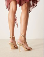bow heeled sandals in gold